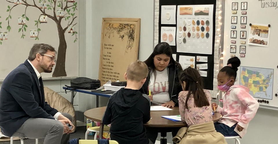 Joe Ross sits in as Reach BA candidate Elizabeth Alonzo works in the classroom in Russellville, Alabama. In addition to Arkansas, Reach also trains educators in California, Louisiana and Alabama. (Reach University)