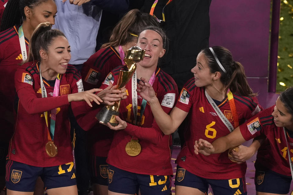 From left to right, Spain's Olga Carmona, Eva Navarro, Aitana Bonmati and Alba Redondo celebrate with their trophy after winning the Women's World Cup soccer final against England at Stadium Australia in Sydney, Australia, Sunday, Aug. 20, 2023. (AP Photo/Mark Baker)