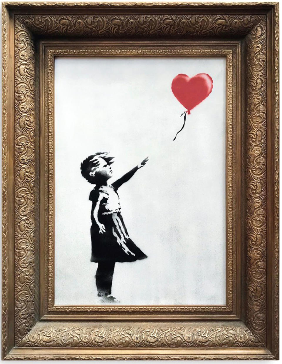 <em>Sale – Girl with Balloon had just sold for £1.04m at Sotheby’s (Picture: PA)</em>