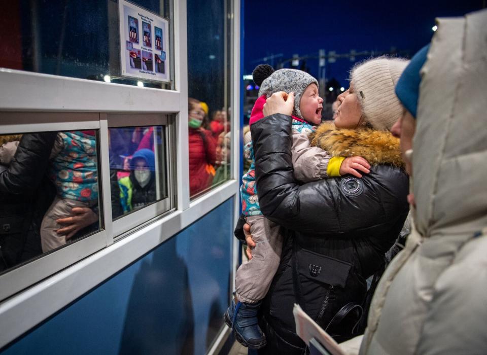 A Ukrainian woman and child at the border of Ukraine and Slovakia.