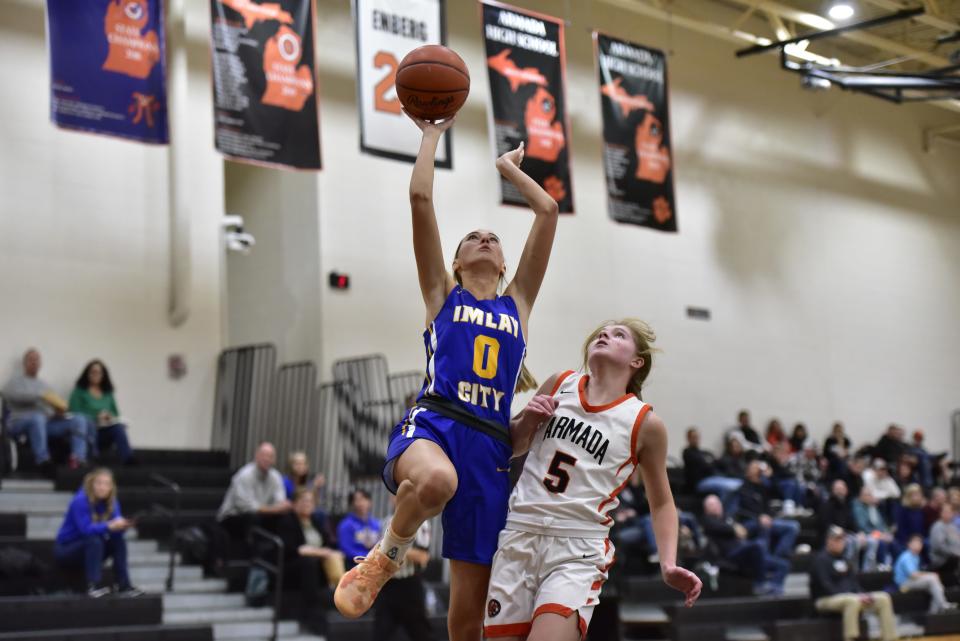 Imlay City's Alyssa Evans goes for a layup during the Spartans' 66-37 win over Armada at Armada High School on Tuesday.