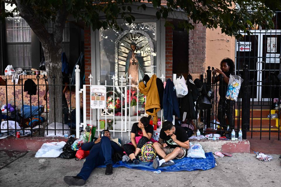 Migrants camp outside of the Sacred Heart Church in downtown El Paso, Texas on May 8, 2023.