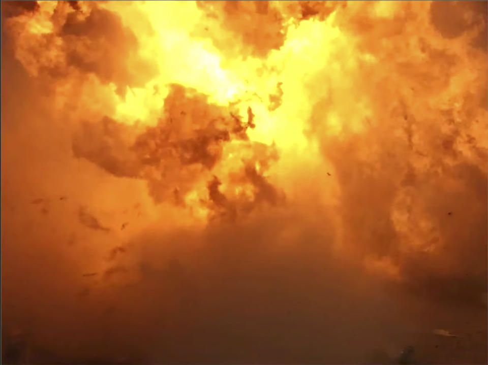 In this screen grab from video posted by SpaceX, the company's Starship becomes engulfed in flames and ruptures upon touching down after a test flight, Wednesday, Dec. 9, 2020, in a remote area of Texas. (SpaceX via AP)