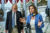 House Speaker Nancy Pelosi of Calif., with Senate Minority Leader Chuck Schumer of N.Y., speaks to reporters following a meeting at the Capitol with White House chief of staff Mark Meadows and Treasury Secretary Steven Mnuchin on a COVID-19 relief bill, Saturday, Aug. 1, 2020, in Washington. (AP Photo/Manuel Balce Ceneta)