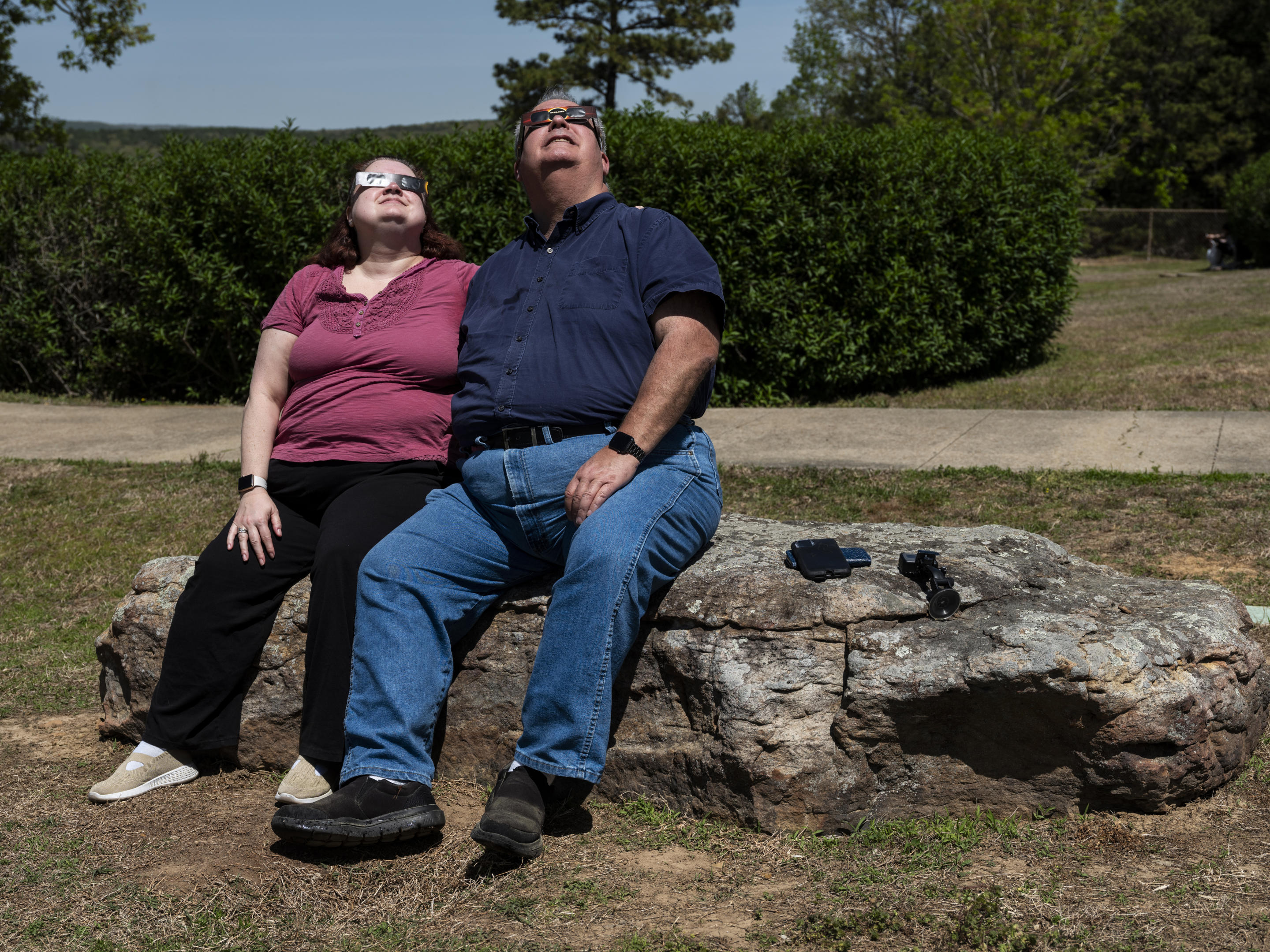 Wendy and Richard Erhard watch the solar eclipse from the John F. Kennedy Memorial Overlook in Cleburne County, Ark