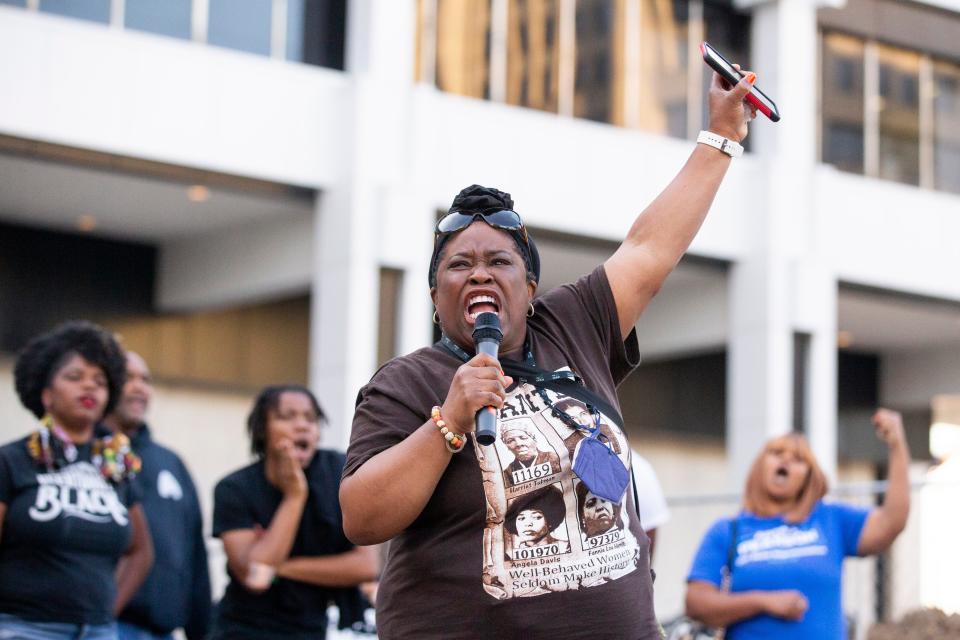 Yolanda Cooper-Sutton leads a chant during a rally outside of Memphis City Hall in support of police reform and to call for the ordinance drafted by Allan Wade, the attorney who represents Memphis City Council, to not be passed in Memphis, Tenn., on Monday, April 10, 2023.