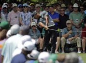 <p>Tiger Woods tees off on the seventh hole during the third round of the Masters golf tournament Saturday, April 11, 2015, in Augusta, Ga. (AP Photo/Matt Slocum) </p>