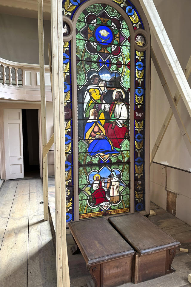 Stained glass window shows Jesus Christ with dark skin, stirring