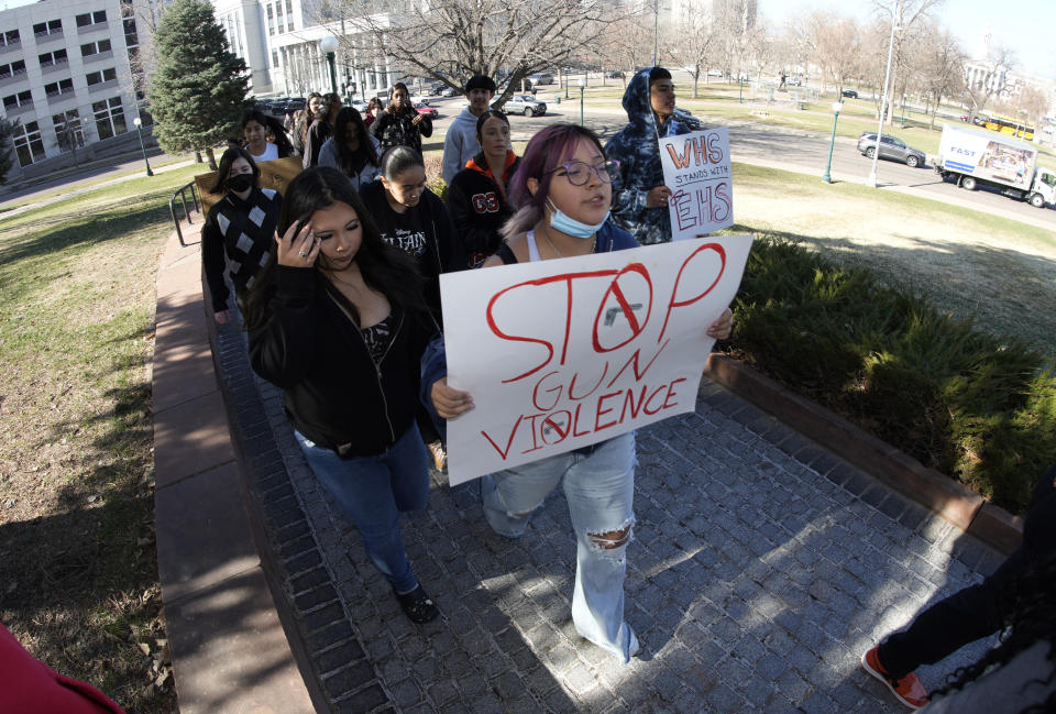 Students from West High School join forces with East High School students to call for gun control measures to be considered by state lawmakers Thursday, March 23, 2023, during a rally outside the State Capitol in Denver. A shooting left two administrators injured at East High School on Wednesday, one of a series of gun-related events at the school in the past six weeks. (AP Photo/David Zalubowski)