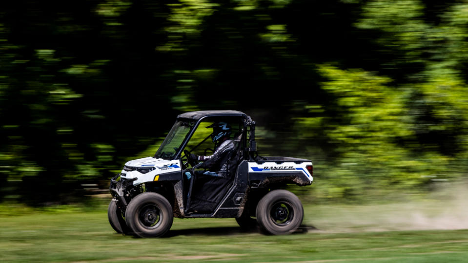 Throw the long shift lever into high, stab the throttle and the Ranger XP Kinetic takes off like a rocket ship. - Credit: Rob Utendorfer, courtesy of Polaris.