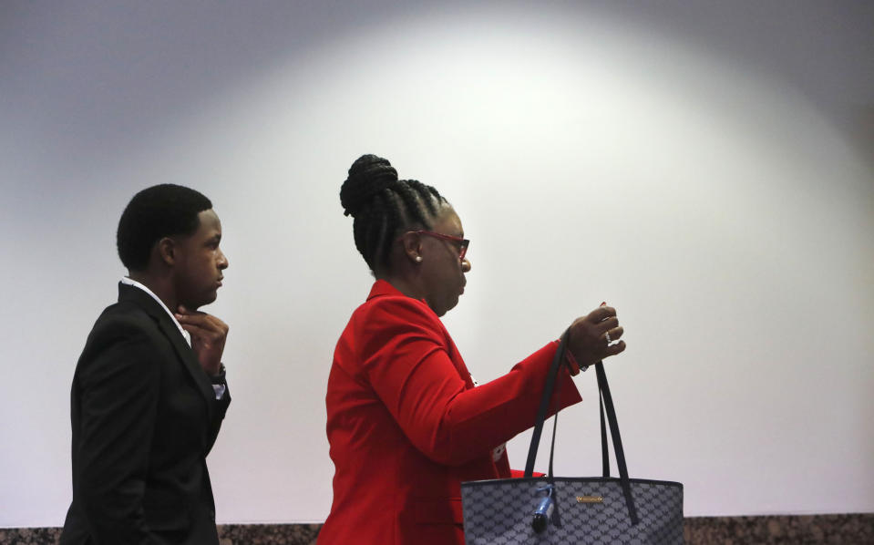 Allison Jean, right, the mother of Botham Jean and Botham's brother Brandt Jean arrive for the murder trial of former Dallas police Officer Amber Guyger in Dallas, Monday, Sept. 23, 2019. Guyger is on trial for shooting and killing her unarmed neighbor Botham Jean. (AP Photo/LM Otero)