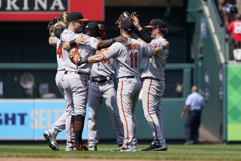 Members of the Baltimore Orioles celebrate a 3-2 victory over the St. Louis Cardinals in a baseball game Thursday, May 12, 2022, in St. Louis. (AP Photo/Jeff Roberson)