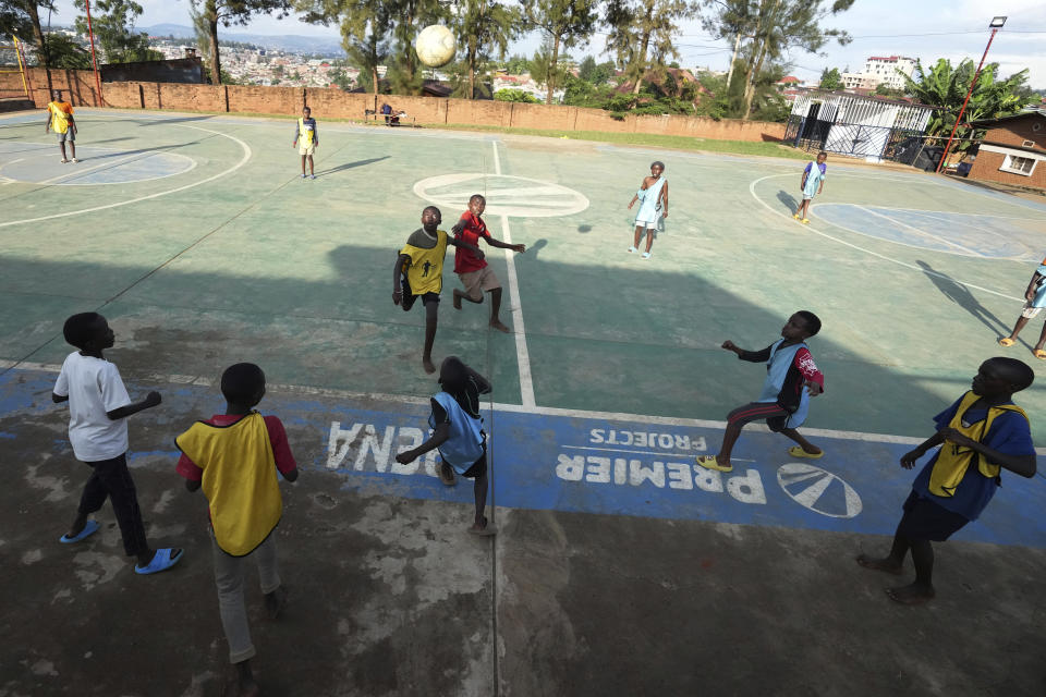 Children play soccer on the outskirts of Kigali, Rwanda, Tuesday, April 4, 2024. The country will commemorate on April 7, 2024, the 30th anniversary of the genocide when ethnic Hutu extremists killed neighbours, friends and family during a three-month rampage of violence aimed at ethnic Tutsis and some moderate Hutus, leaving a death toll that Rwanda puts at 1,000,050. (AP Photo/Brian Inganga)