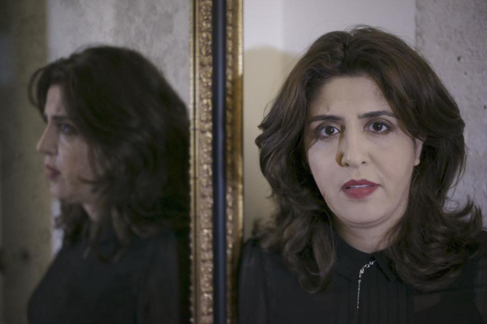 PR agent Francesca Chaouqui is photographed during an interview with The Associated Press about her book 'In the Name of Peter' (Nel Nome di Pietro), a behind-the-scenes drama of a papal reform commission that ended in disgrace after its documents were leaked to two journalists, in Rome, Monday, Feb. 6, 2017. Chaouqui received a suspended sentence for her role in the leaks, and is tempting Vatican prosecutors by publishing confidential documents in her book that hits bookstores Tuesday (AP Photo/Andrew Medichini)