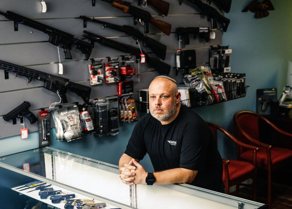 David Kowalsky, 48, owner of Florida Gun Store, stands for a portrait in his shop in Hollywood, Fla. (Scott McIntyre for NBC News)