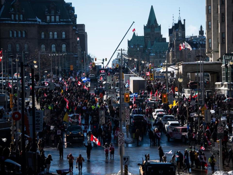 People and vehicles fill Wellington Street near Parliament Hill during a rally against COVID-19 restrictions on Saturday.  (Justin Tang/The Canadian Press - image credit)