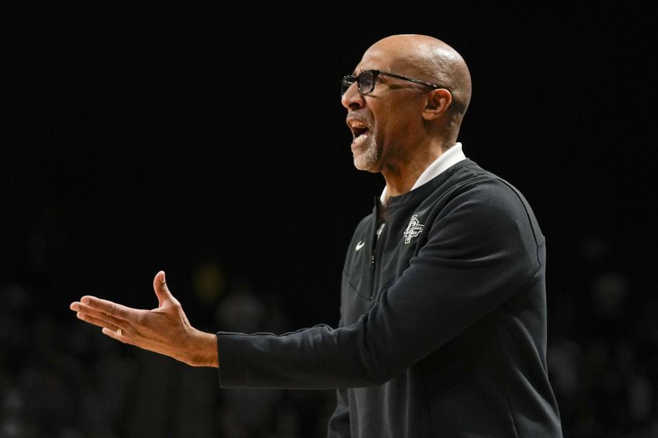 Central Florida head coach Johnny Dawkins questions a call by an official during the first half of an NCAA college basketball game against Texas Tech, Saturday, Feb. 24, 2024, in Orlando, Fla. (AP Photo/John Raoux)