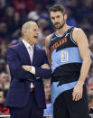 Cleveland Cavaliers coach John Beilein, left, talks with Kevin Love during the first half of the team's NBA basketball game against the New Orleans Pelicans, Tuesday, Jan. 28, 2020, in Cleveland. (AP Photo/Tony Dejak)