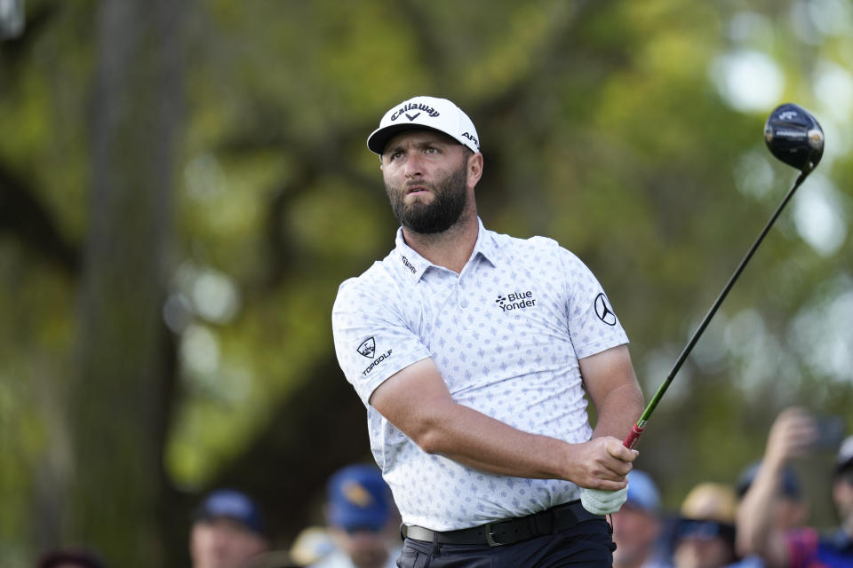 Jon Rahm, of Spain, watches his tee shot from the 12th tee during the first round of the Players Championship golf tournament Thursday, March 9, 2023, in Ponte Vedra Beach, Fla. (AP Photo/Charlie Neibergall)