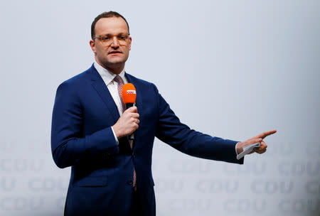 Christian Democratic Union (CDU) candidate for the party chair Jens Spahn delivers a speech as he attends a regional conference in Duesseldorf, Germany, November 28, 2018. REUTERS/Thilo Schmuelgen/Files
