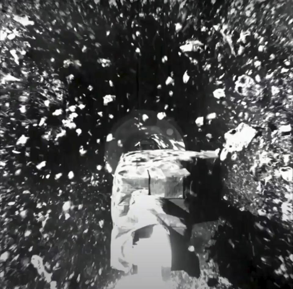 A view of a spacecraft amid floating debris