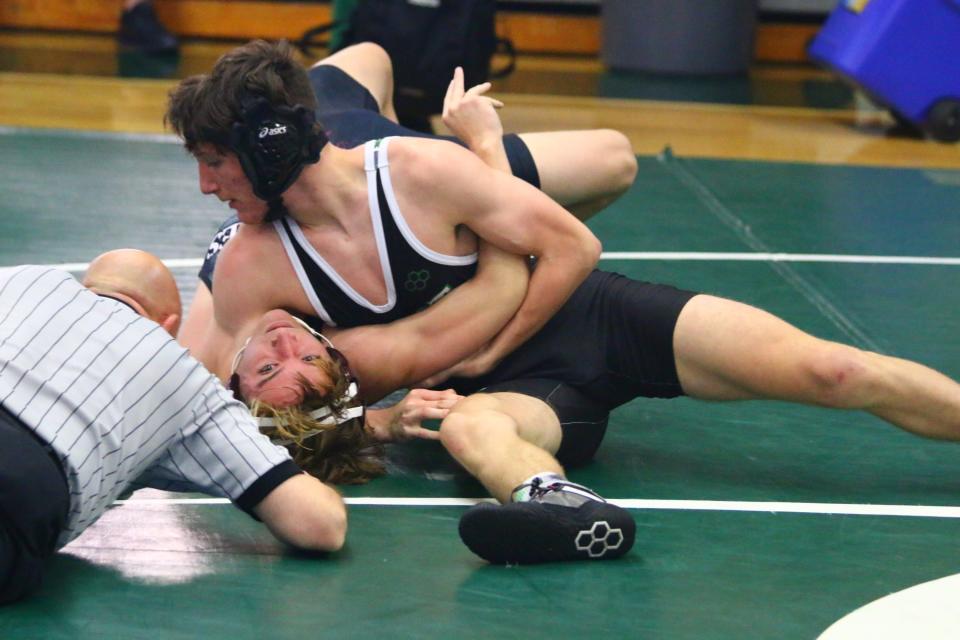 Fort Myers High School's Ethan DiNottia  pins his opponent during a match at the Gary Freis Duals held Saturday, Dec. 4 at Fort Myers High School.