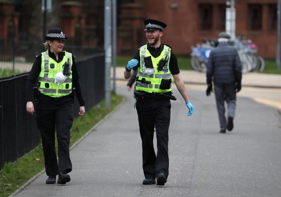 Police patrol the streets near Kelvingrove Art Gallery and Museum as the UK continues in lockdown to help curb the spread of the coronavirus.