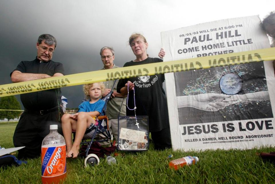 Supporters of Paul Hill pray for him prior to his execution outside of Florida state prison in 2003. Hill was executed for the 1994 killings of Britton and Barrett.