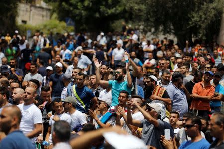 Palestinians shout slogans as they protest outside Jerusalem's Old city July 21, 2017. REUTERS/Ronen Zvulun