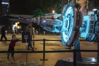 A child stands near a depiction of a space craft at an exhibition about "The Three-Body Problem" in Chengdu, Sichuan province on Friday, Oct. 20, 2023. The series that began with "The Three-Body Problem," written by former engineer Liu Cixin, helped Chinese science fiction break through internationally, winning awards and making it onto the reading lists of the likes of former U.S. President Barack Obama and Mark Zuckerberg. (AP Photo/Ng Han Guan)