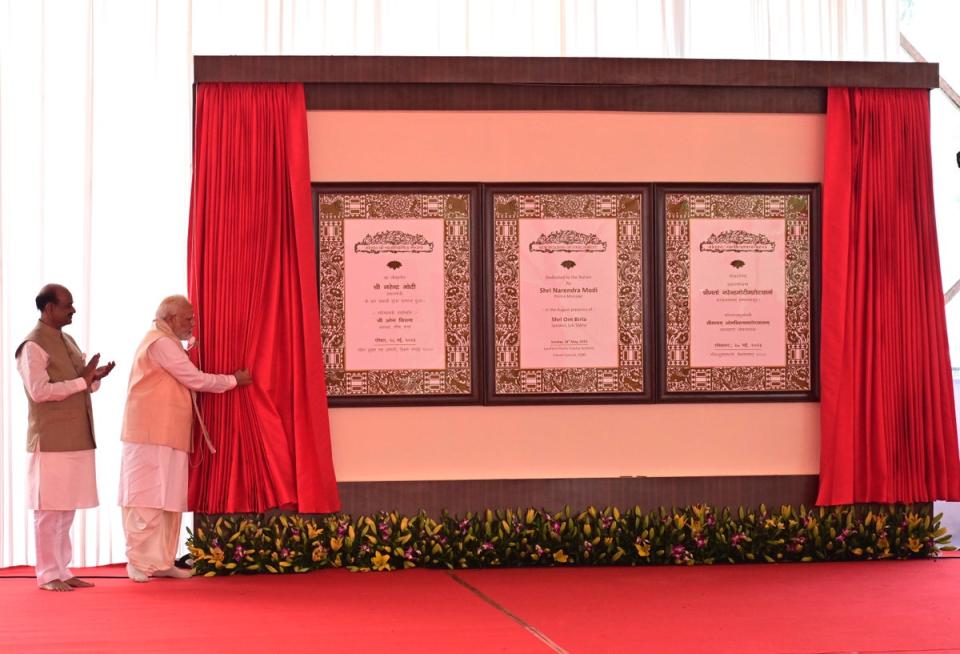 Modi inaugurates the new parliament building watched by the speaker of the lower house, Om Birla (AP)
