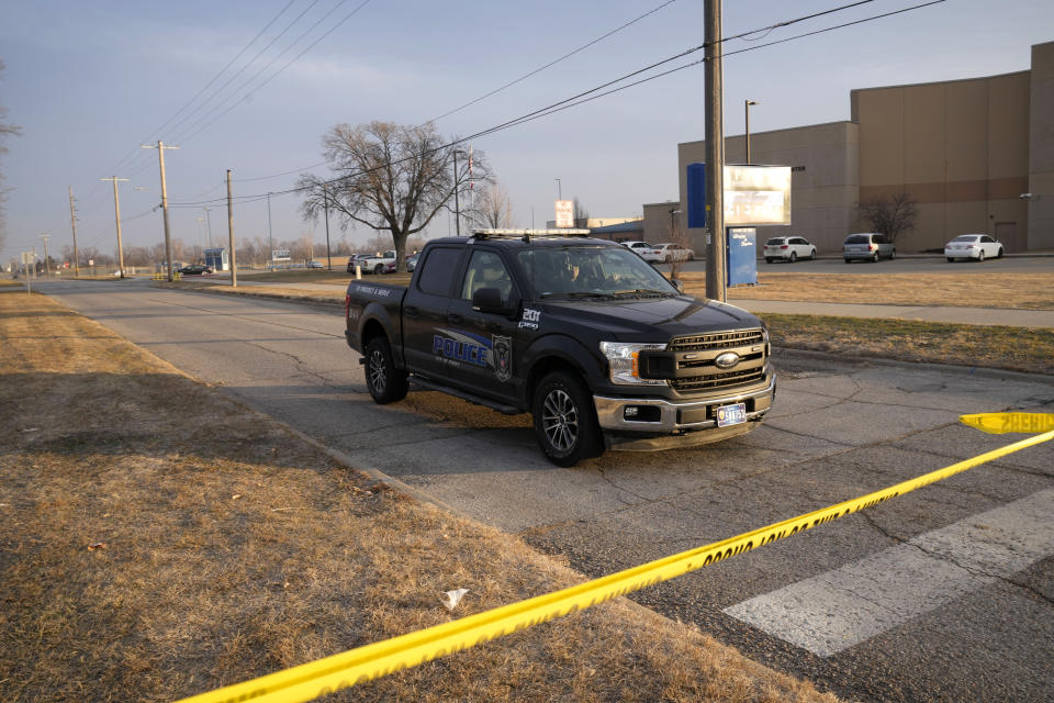 A police vehicle passes Perry High School following a shooting Thursday at the school, Friday, Jan. 5, 2024, in Perry, Iowa. (AP Photo/Charlie Neibergall)