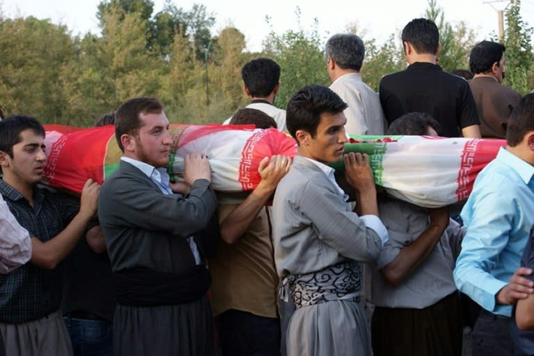 Iranian Kurds (pictured October 2010) carry the flag-drapped bodies of victims of a bomb atttack that tore through an Iranian military parade on September 22, 2010, killing 12 people in the ethnically Kurdish northwestern town of Mahabad