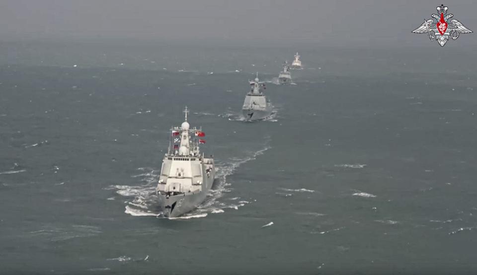 In this handout photo taken from video released by Russian Defense Ministry Press Service on Thursday, Dec. 22, 2022, Chinese warships take part in joint naval drills with Russia in the East China Sea on Thursday. The exercise showcases increasingly close defense ties between the two countries as they both face tensions with the United States. (Russian Defense Ministry Press Service via AP)