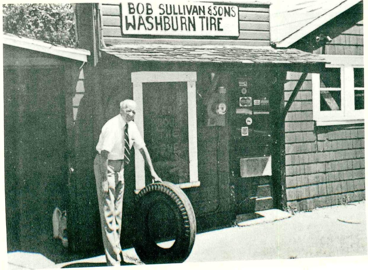 Robert Sullivan Sr. stands outside the first Sullivan Tire shop in Rockland, Mass. Sullivan Tire now has 117 locations and nearly 1,500 employees in New England. Paul and Robert Sullivan Jr. announced an Employee Stock Ownership plan on Nov. 6.