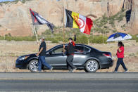 In this image provided by the Navajo Nation Office of the Speaker, family members and advocates participating in a walk on the Navajo Nation, Wednesday, May 5, 2021, near Window Rock, Ariz., to commemorate a day of awareness for the crisis of violence against Indigenous women and children. (Byron C. Shorty, Navajo Nation Office of the Speaker via AP)