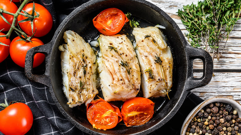 Fried cod fillets in pan