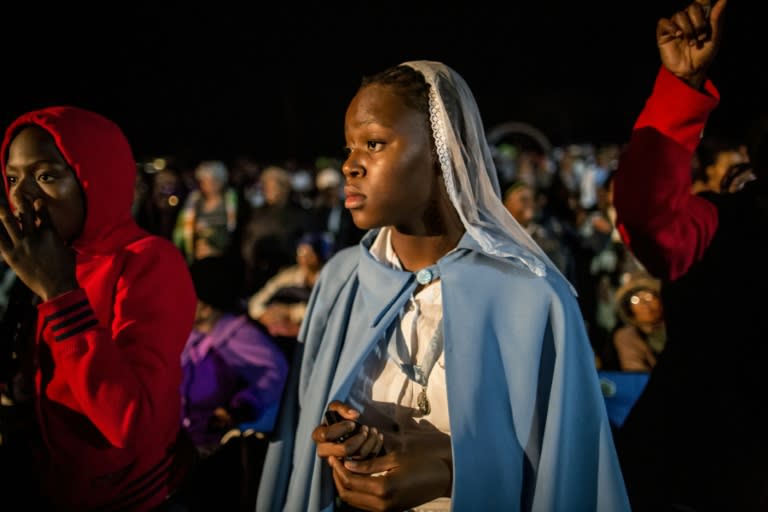 A worshipper prays at the beginning of a vigil in Thohoyandou for the beatification of the first South African, on September 12, 2015