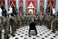 <p>Rep. Brian Mast (R-FL) (C) gives members of the National Guard a tour of the U.S. Capitol on January 13, 2021 in Washington, DC.</p>