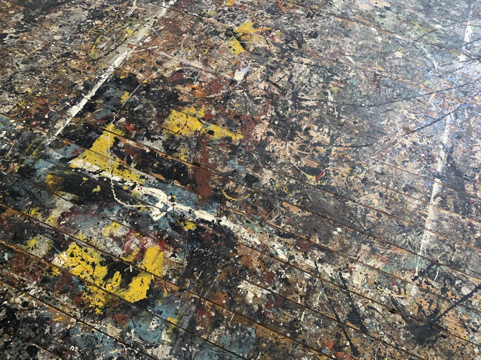 House paint and black floor enamel used by American Abstract Expressionist artist Jackson Pollock appear on the floor in the artist's studio at the Pollock-Krasner House and Study Center on Sunday, June 6, 2021, in The Springs, a hamlet in East Hampton, N.Y. Visitors can reserve tickets for a docent-led tour. (AP Photo/Pamela Hassell)