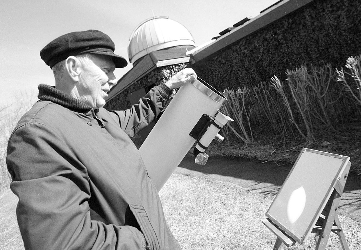 Art Koch, a volunteer at The John J. Crowley Nature Center at Rifle Camp Park in Woodland Park, views a projection of the partial eclipse of the sun. He is using an 8 inch telescope.