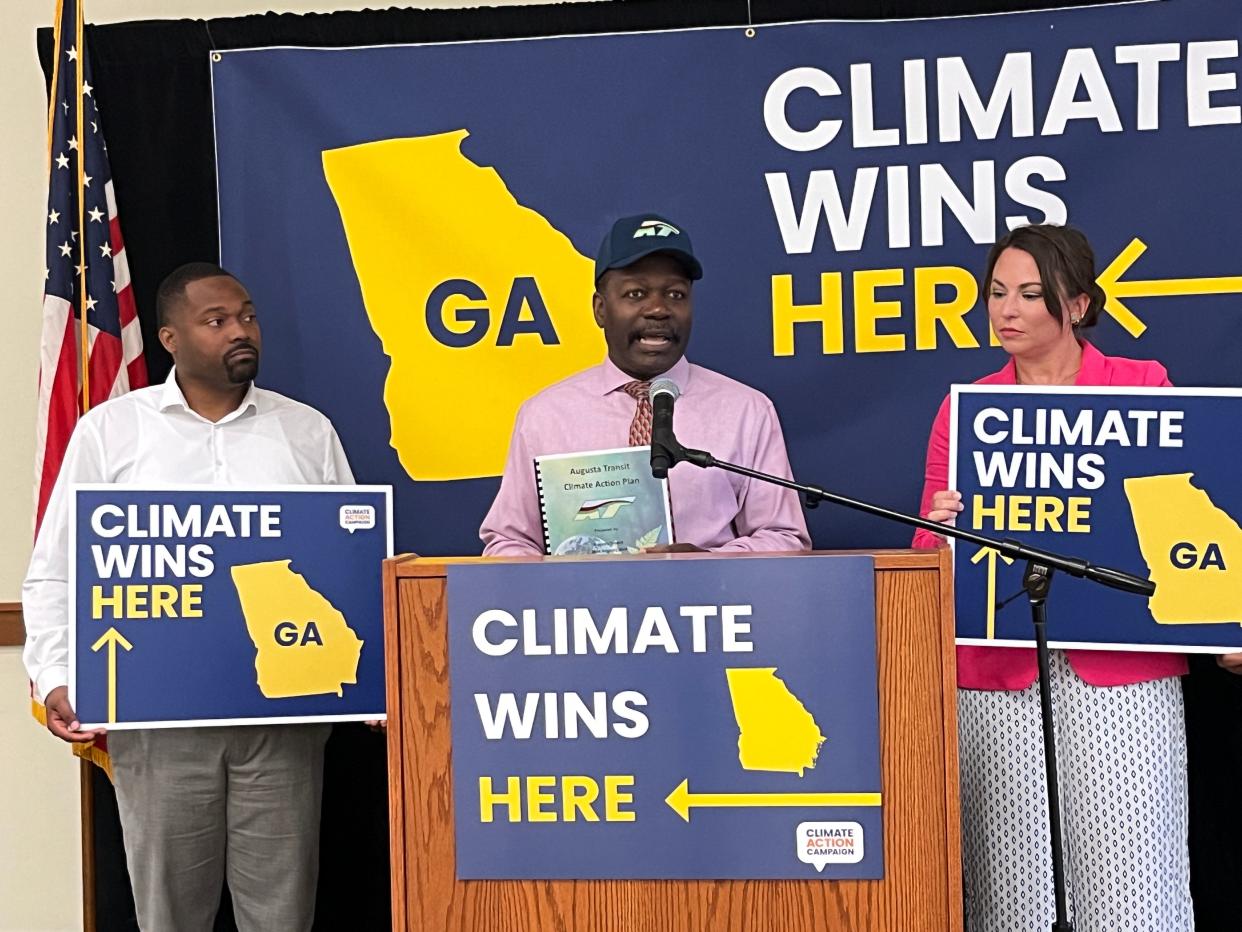 Augusta Transit Deputy Director Oliver Page, center, presents their Climate Action Plan alongside Augusta Commissioner Jordan Johnson, left, and Citizens Climate Lobby Volunteer Paige Brookmeyer, right, at a press conference on combating climate change at the Augusta Public Library on Telfair Street in Augusta, GA on Thursday, March 23, 2023.