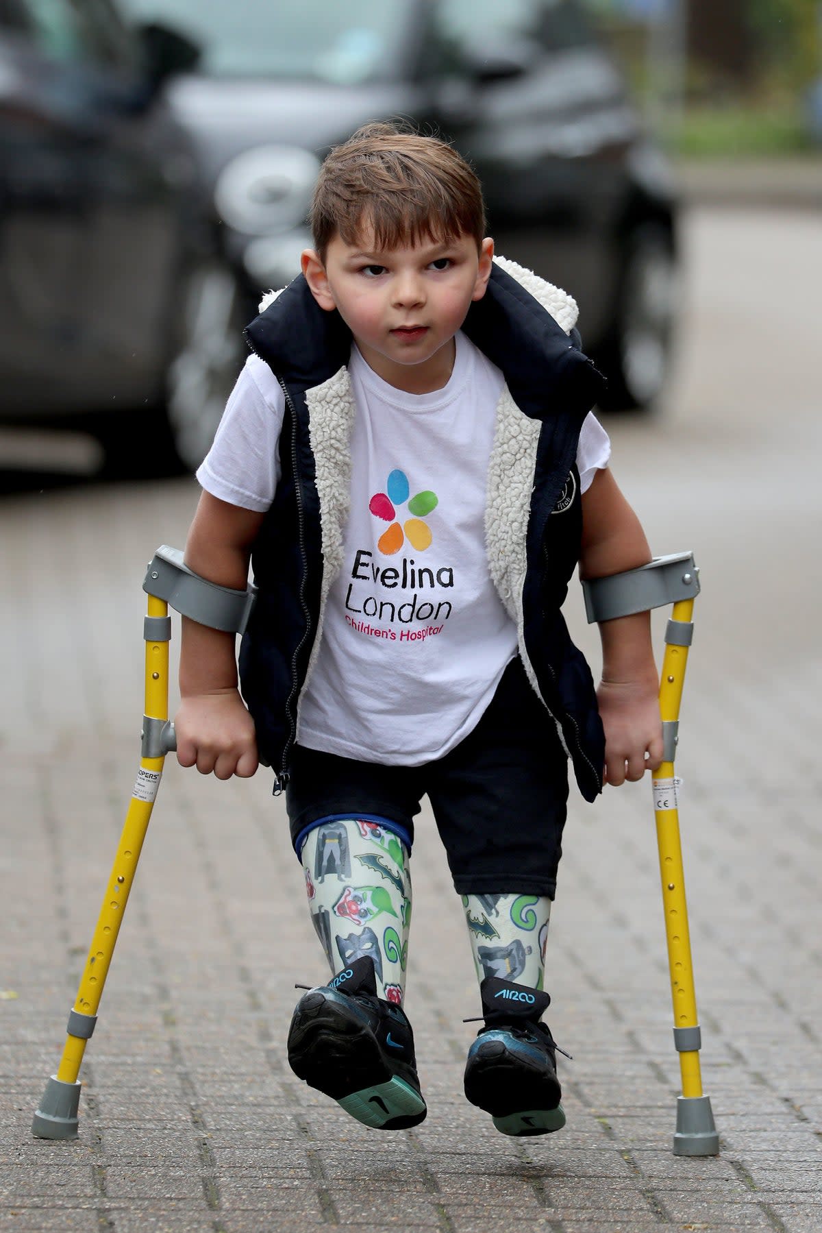 Tony Hudgell, who uses prosthetic legs, takes the final steps in his fundraising walk in West Malling Kent. Five-year-old Tony has raised more than �1,000,000 for the Evelina London Children’s Hospital, who have cared for him since he was four-months-old, by walking every day in June, covering a distance of 10 kilometres. (PA Archive)