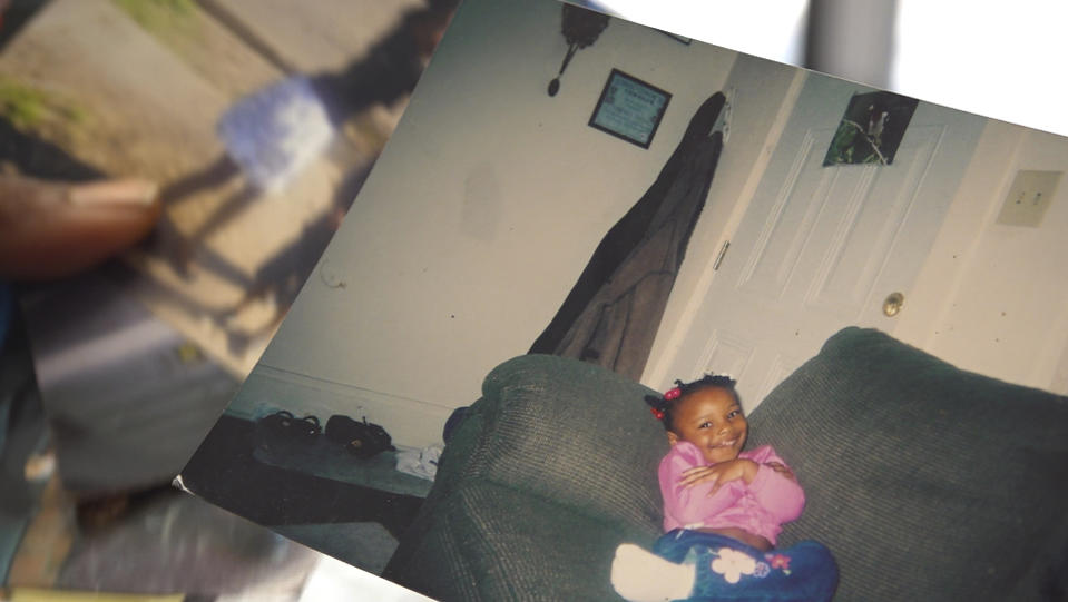 Nadine Young holds a childhood photograph of her granddaughter, Ta'Kiya Young, at the law offices of the family attorney in Columbus, Ohio, on Wednesday, Sept. 6, 2023. Ta'Kiya Young was shot and killed on Aug. 24 by Blendon Township police outside an Ohio supermarket. The 21-year-old was pregnant and due to give birth in November, according to her family. (Courtesy of Young Family via AP)