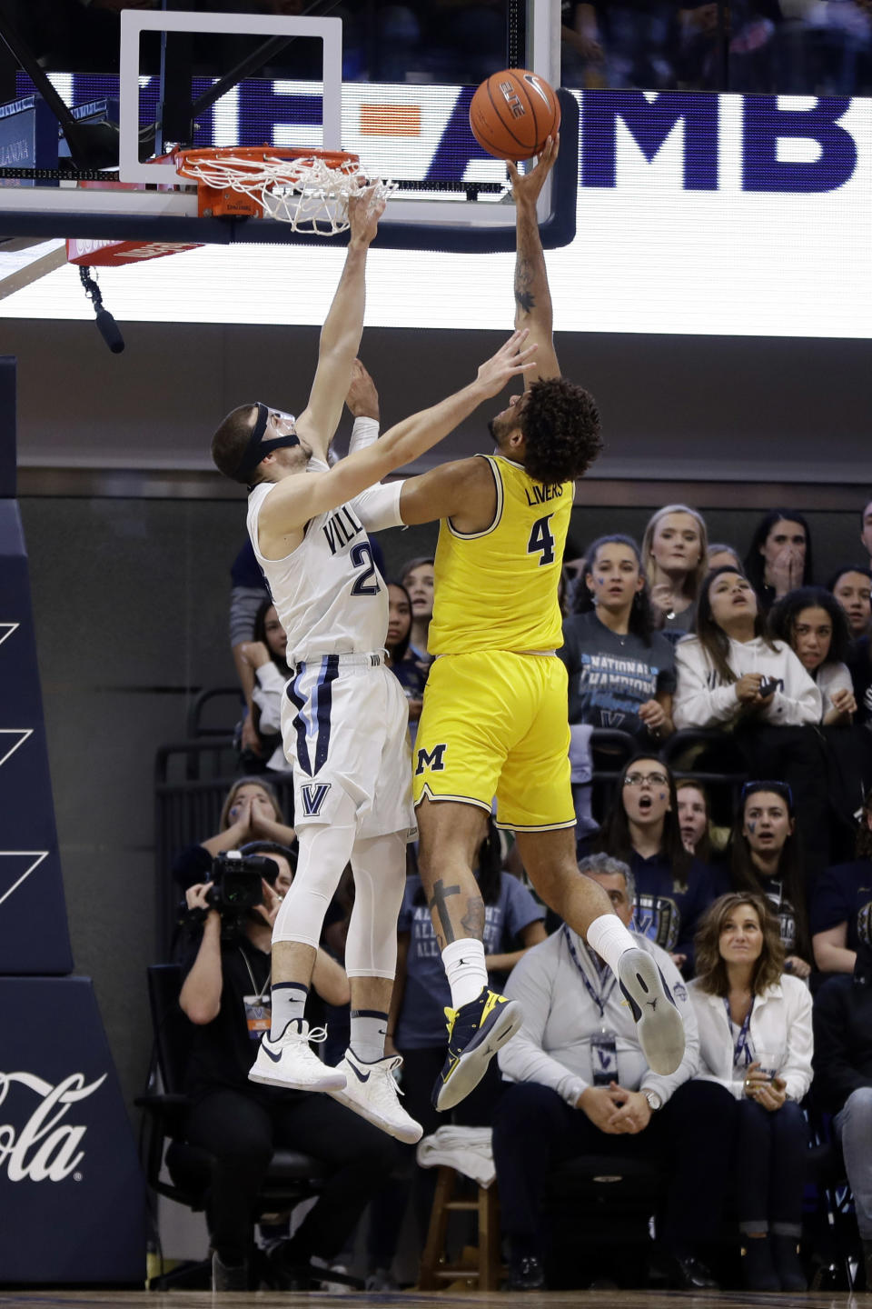 Michigan's Isaiah Livers, right, goes up for a shot against Villanova's Joe Cremo during the first half of an NCAA college basketball game, Wednesday, Nov. 14, 2018, in Villanova. (AP Photo/Matt Slocum)