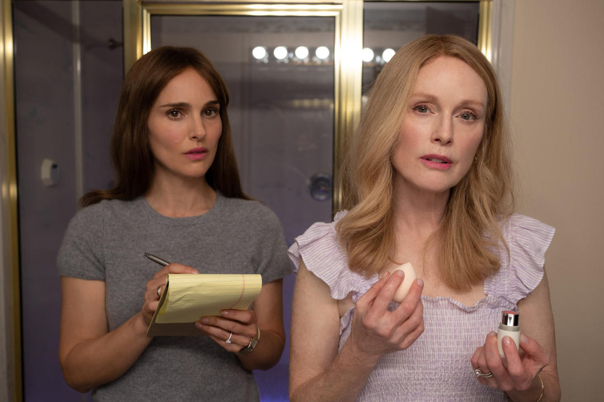 Natalie Portman observes Julianne Moore as they both look in a mirror during a scene in 