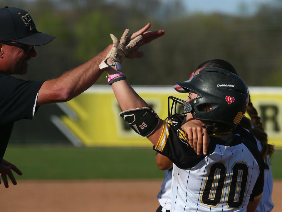 Watkins Memorial's Ava McKee celebrates a home run against Granville on Thursday.