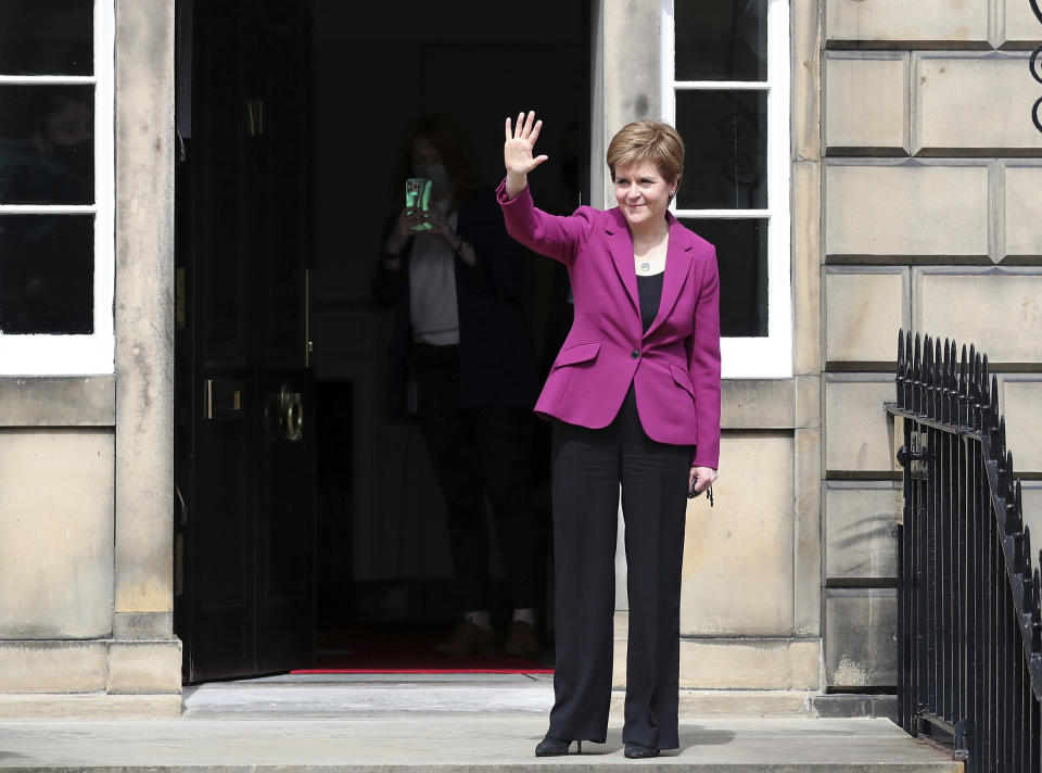 Scotland's First Minister and Scottish National Party leader Nicola Sturgeon poses for photographers, at Bute House in Edinburgh, Scotland. Sunday, May 9, 2021. British Prime Minister Boris Johnson has invited the leaders of the U.K.’s devolved nations for crisis talks on the union after Scotland’s pro-independence party won its fourth straight parliamentary election. Sturgeon said the election results proved a second independence vote for Scotland was “the will of the country." She said any London politician who stood in the way would be “picking a fight with the democratic wishes of the Scottish people.” (AP Photo/Scott Heppell)