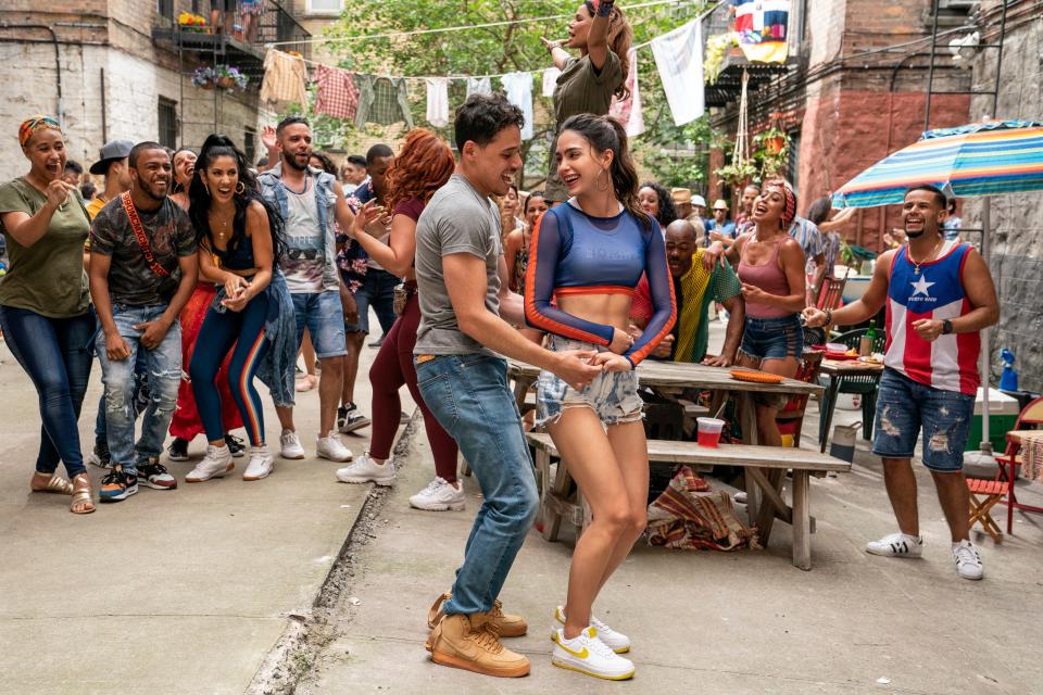 Anthony Ramos (center, with Melissa Barrera) stars as a likable bodega owner in "In the Heights," a new adaptation of Lin-Manuel Miranda's Broadway musical."