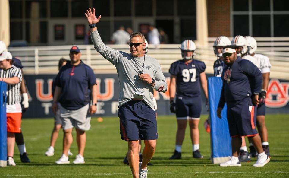 Auburn football coach Bryan Harsin directs the team on the first day of spring practices, March 14, 2022, on Auburn's practice field.